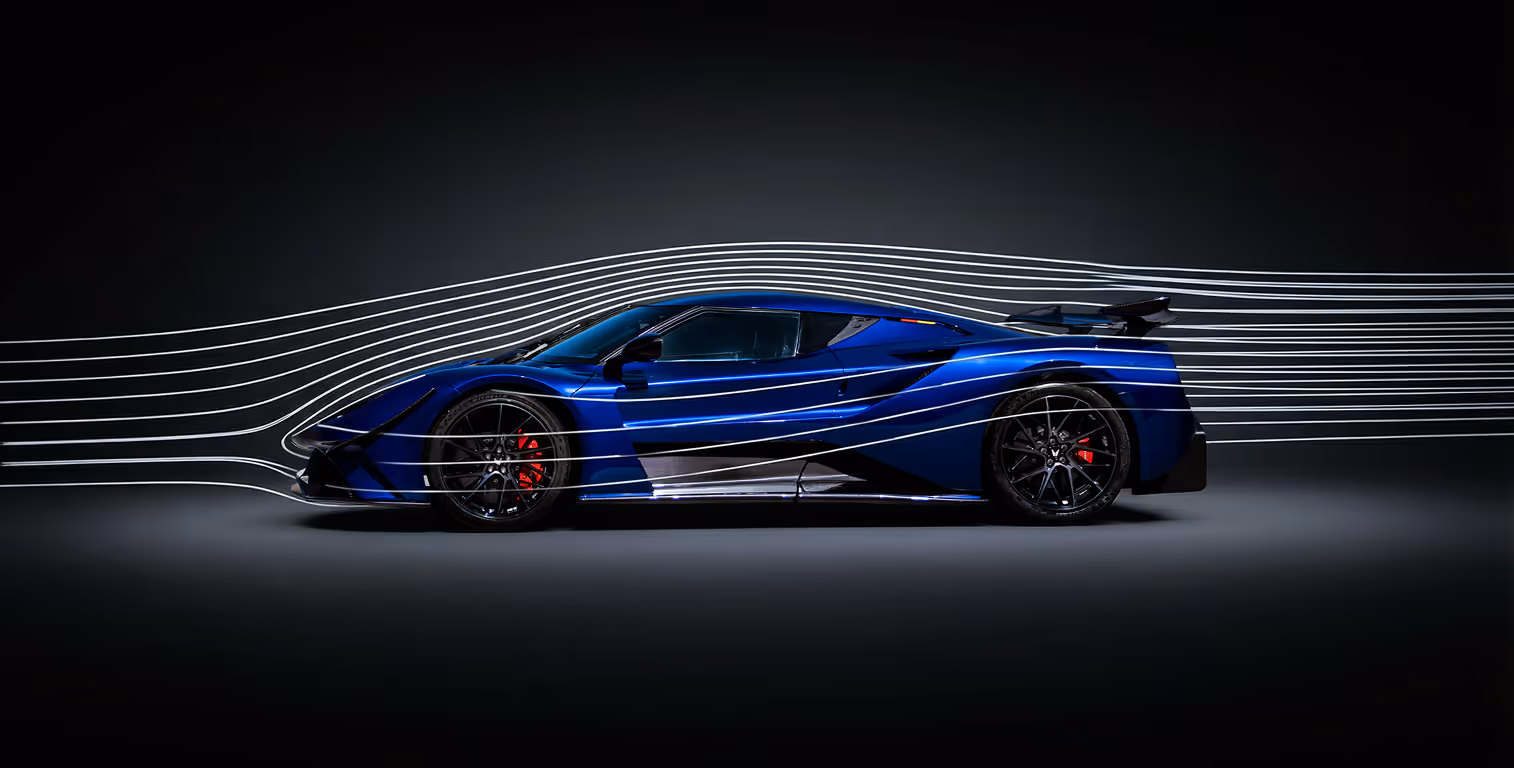 Side view of a sleek blue sports car with aerodynamic flow lines illustrating air movement over the body.