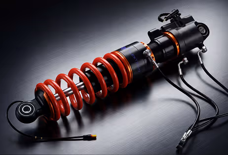 Silver and black high-performance electric motor with carbon fiber casing and Elektron logo.