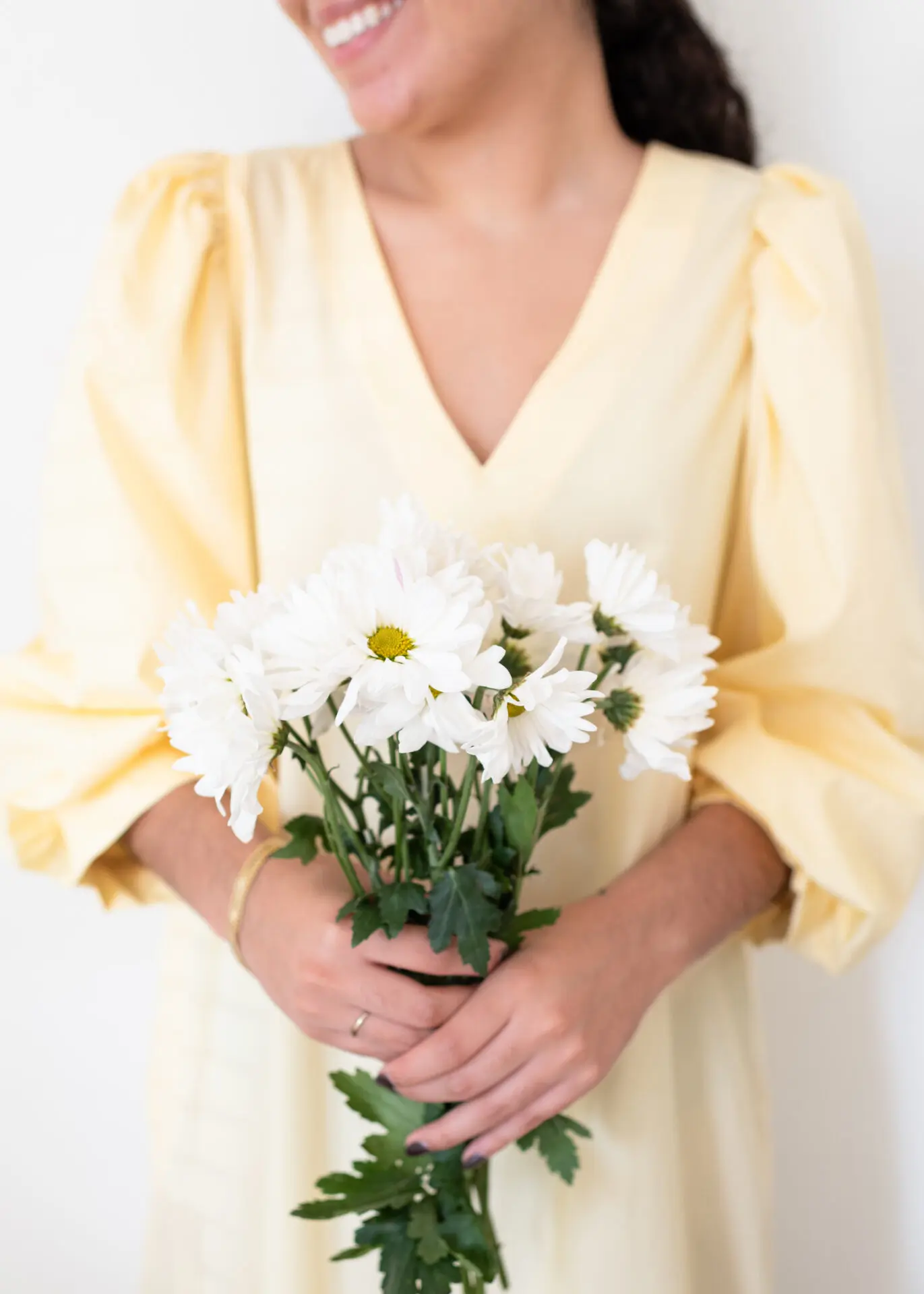 woman holding flowers in her hands