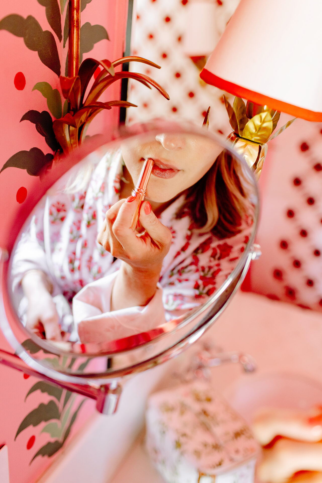 woman applying lipstick