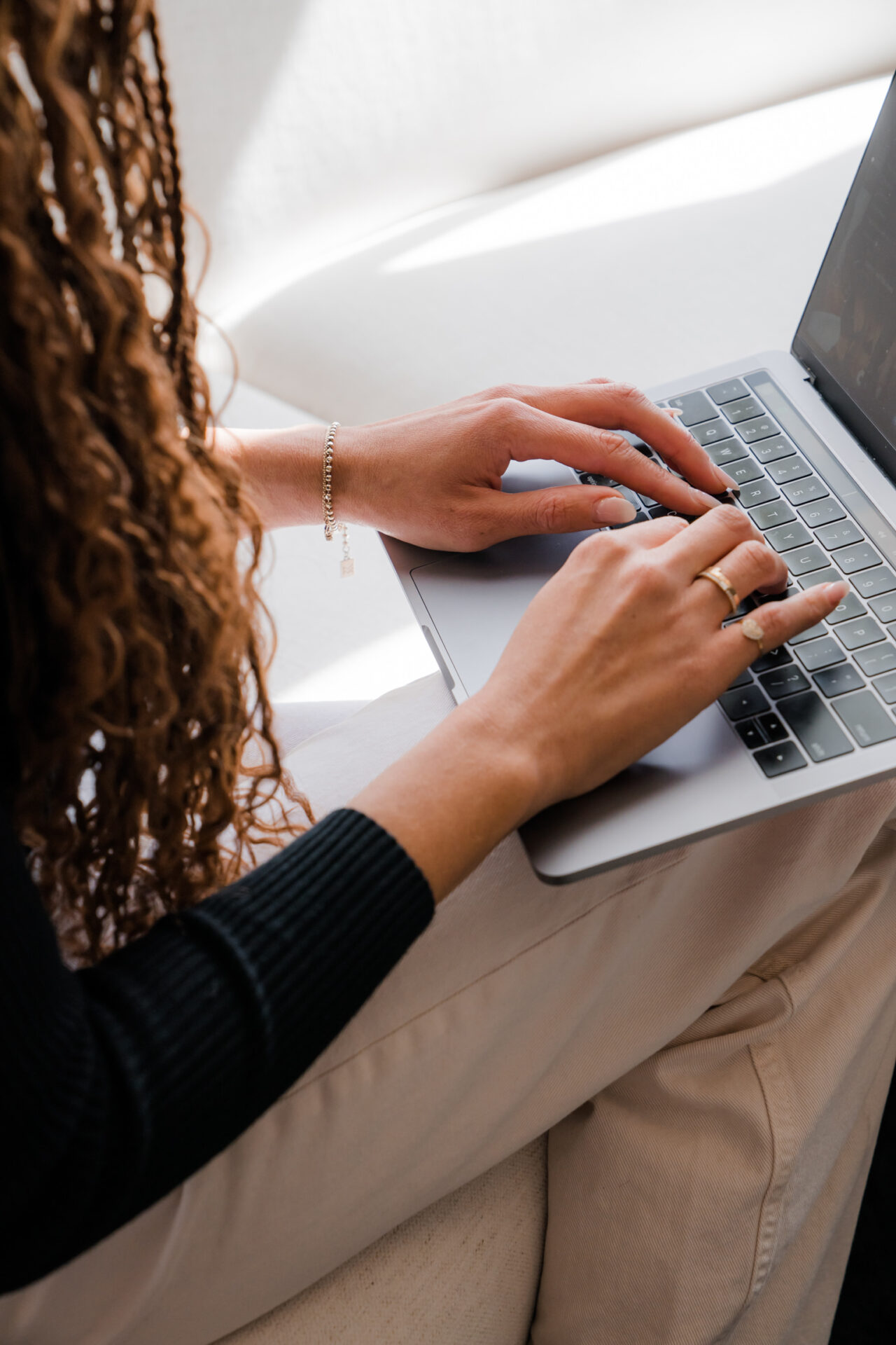 woman typing into a laptop