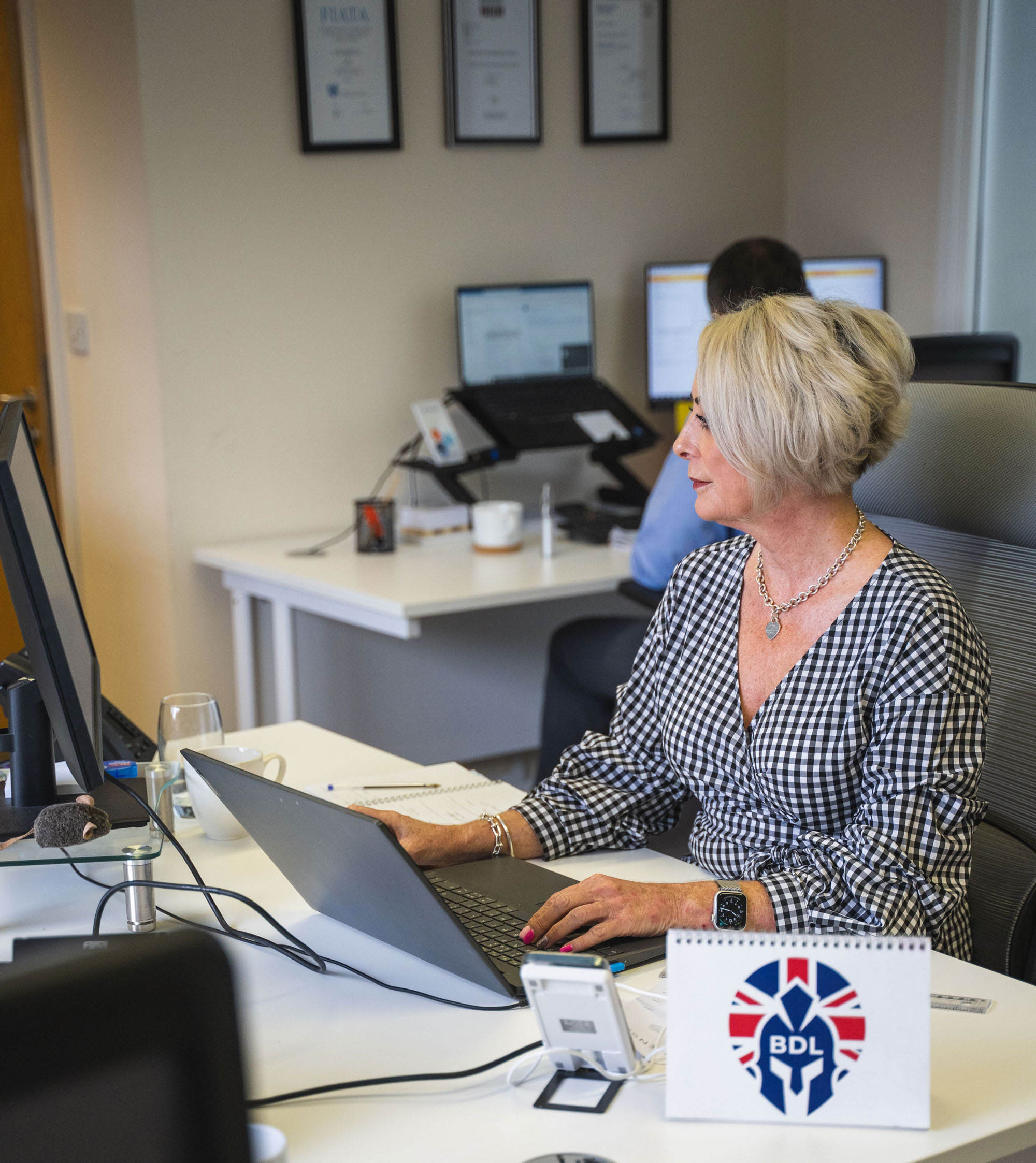 Lady sitting at desk
