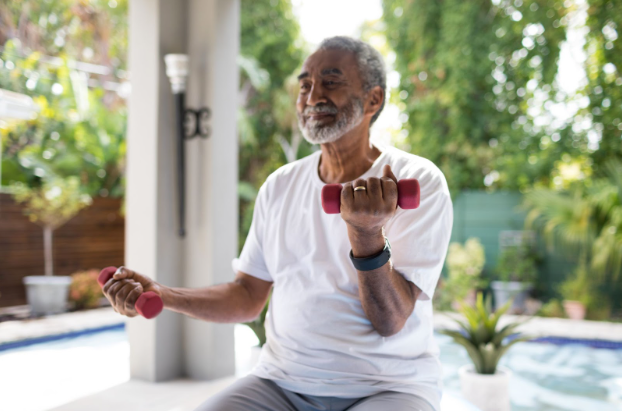 Senior man lifting dumbbells