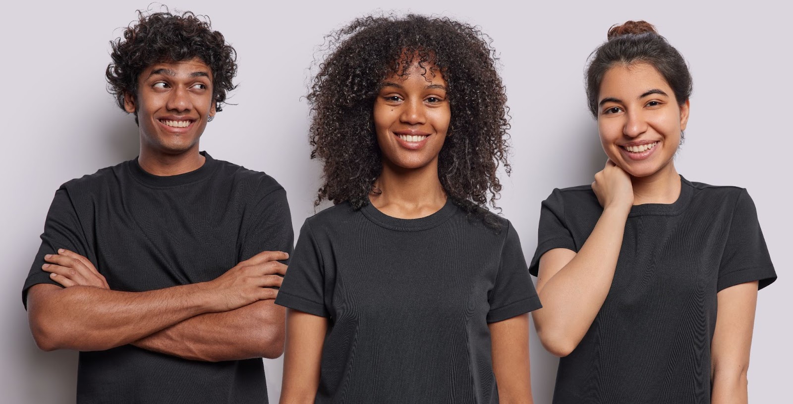 A group of professionals dressed in black smile at the camera.