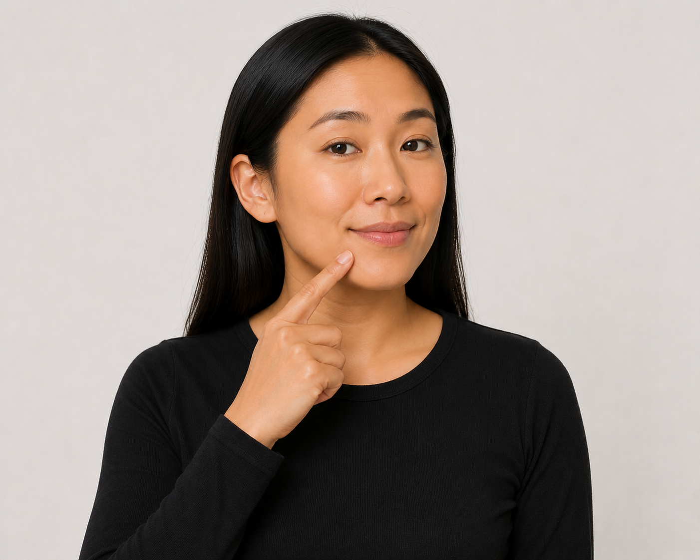Person demonstrating the mouth contact point used when signing deaf in ASL