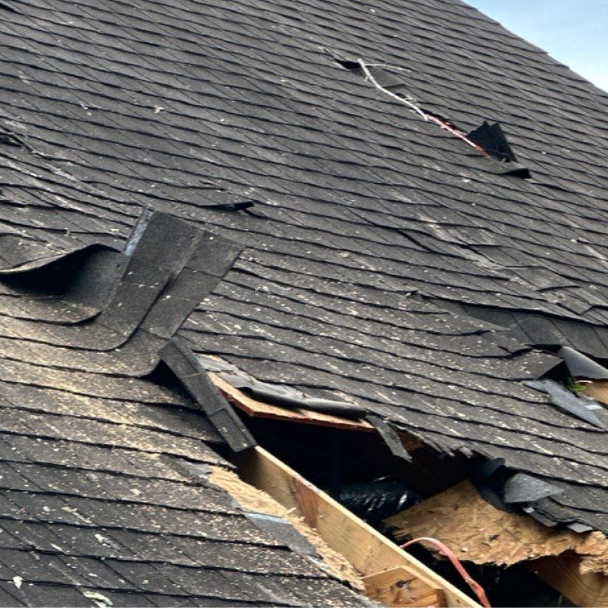 Severely deteriorated roof shingles from prolonged hail damage exposure