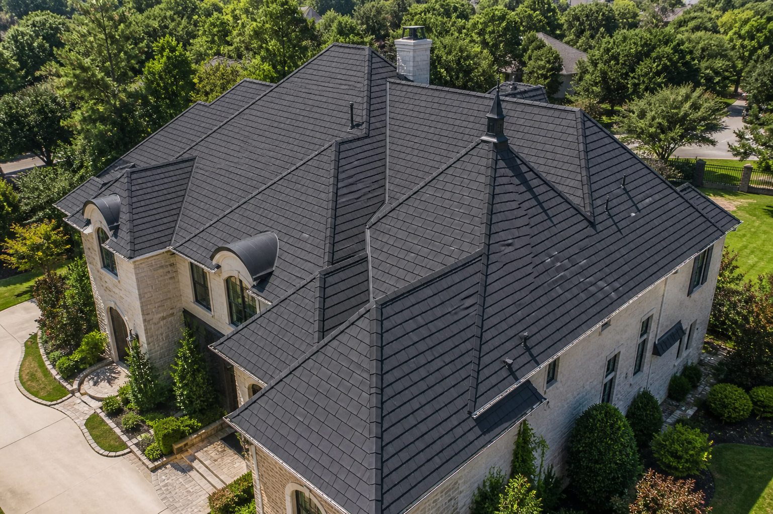 Aerial view of a Houston home with a dark synthetic composite slate roof