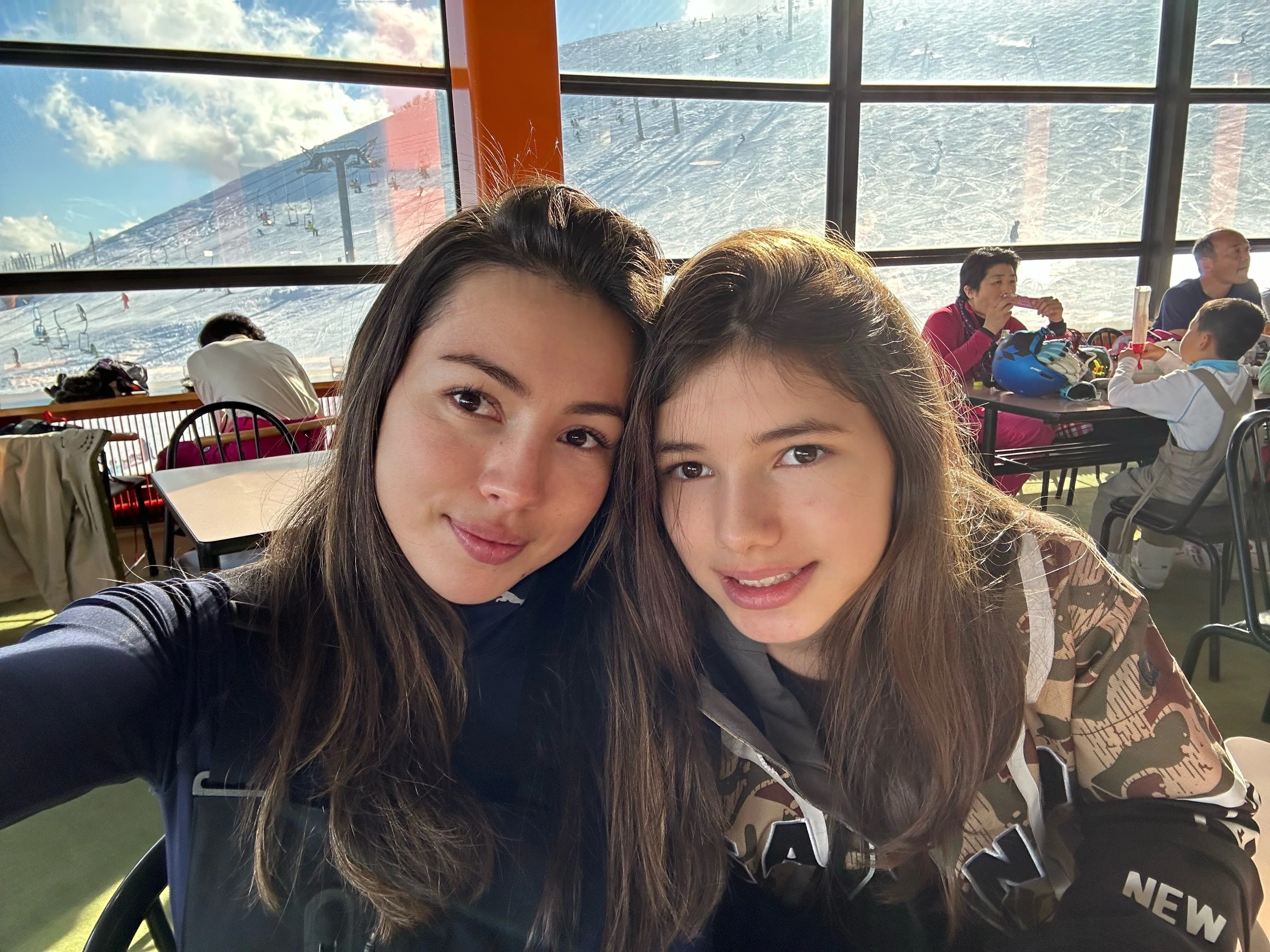 Two women taking a selfie at a stadium