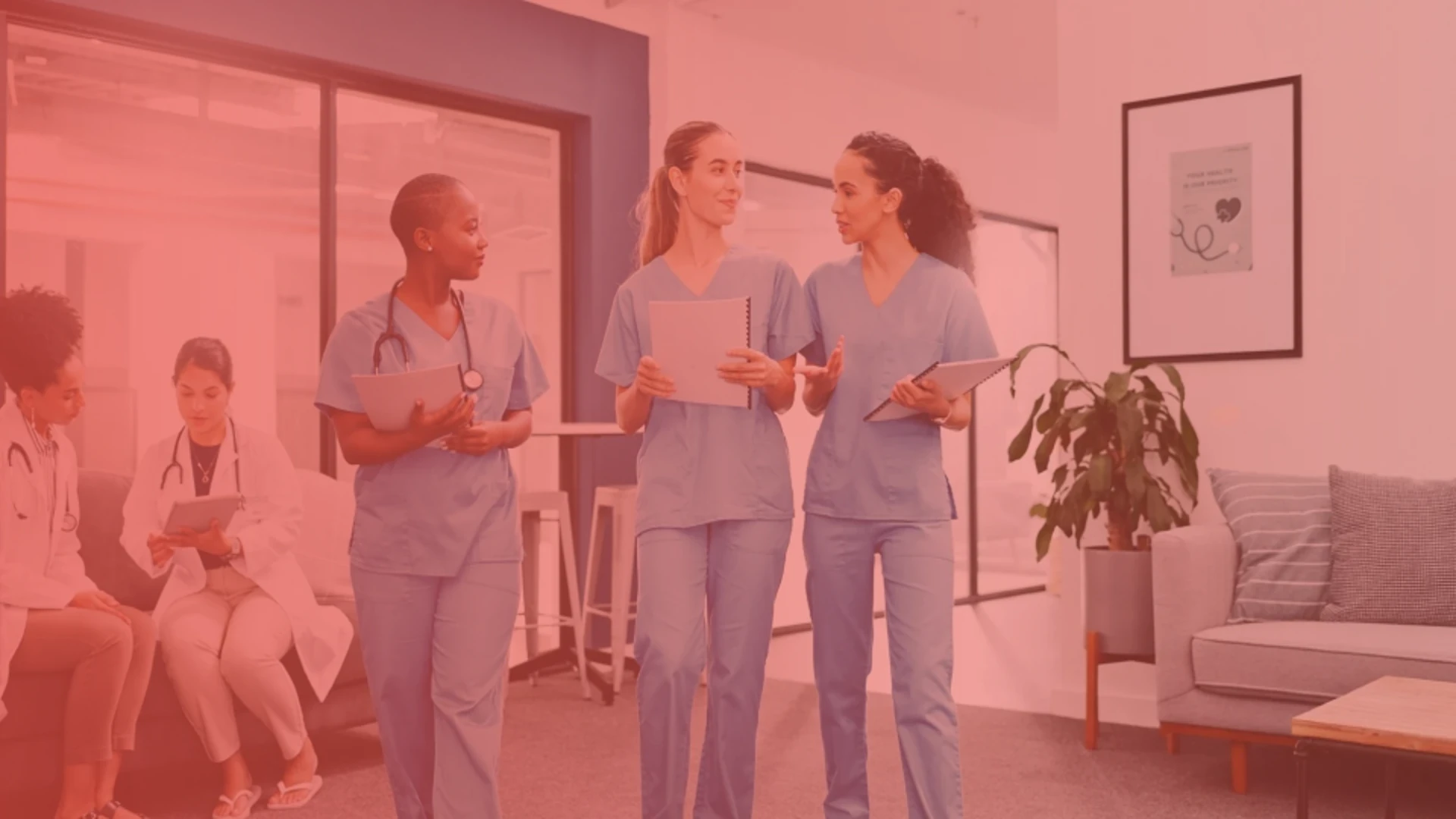 Nursing students walking together and talking inside a healthcare learning facility.