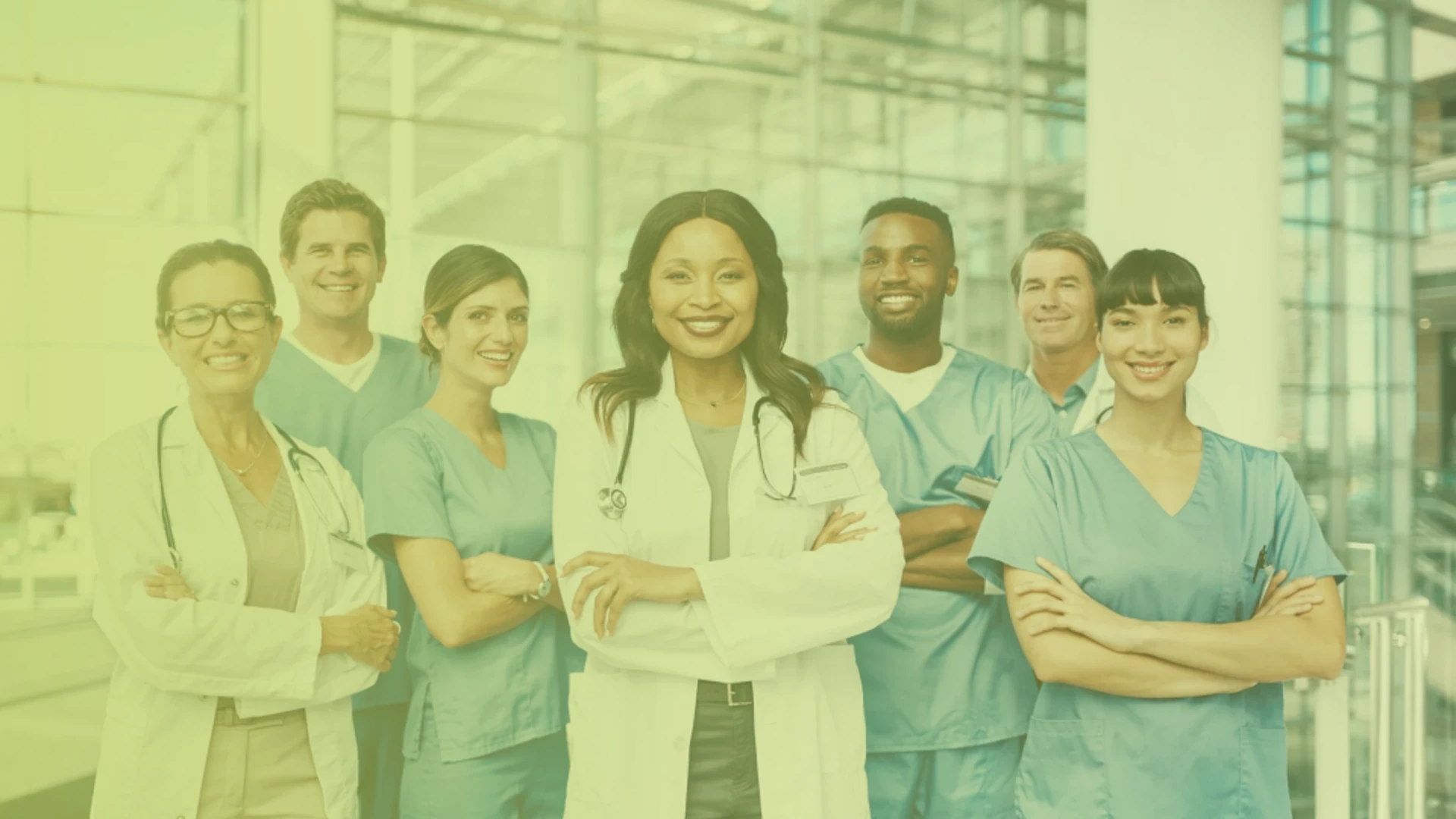 Group of diverse healthcare professionals standing together in a hospital.