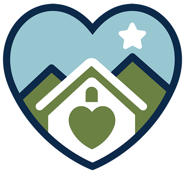 Graphic of a house with a heart on it, set against green mountains and a blue sky with a white star, all within a dark blue heart shape.