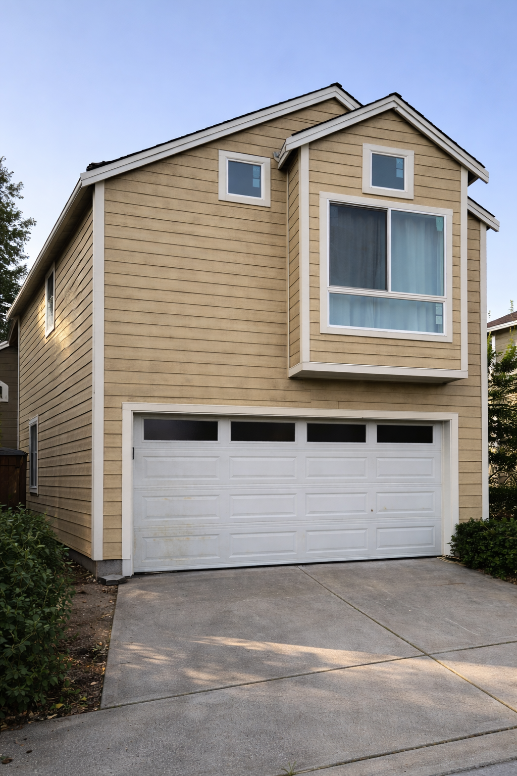 A grayscale photo of wooden kitchen shelves holding various bowls and carafes.