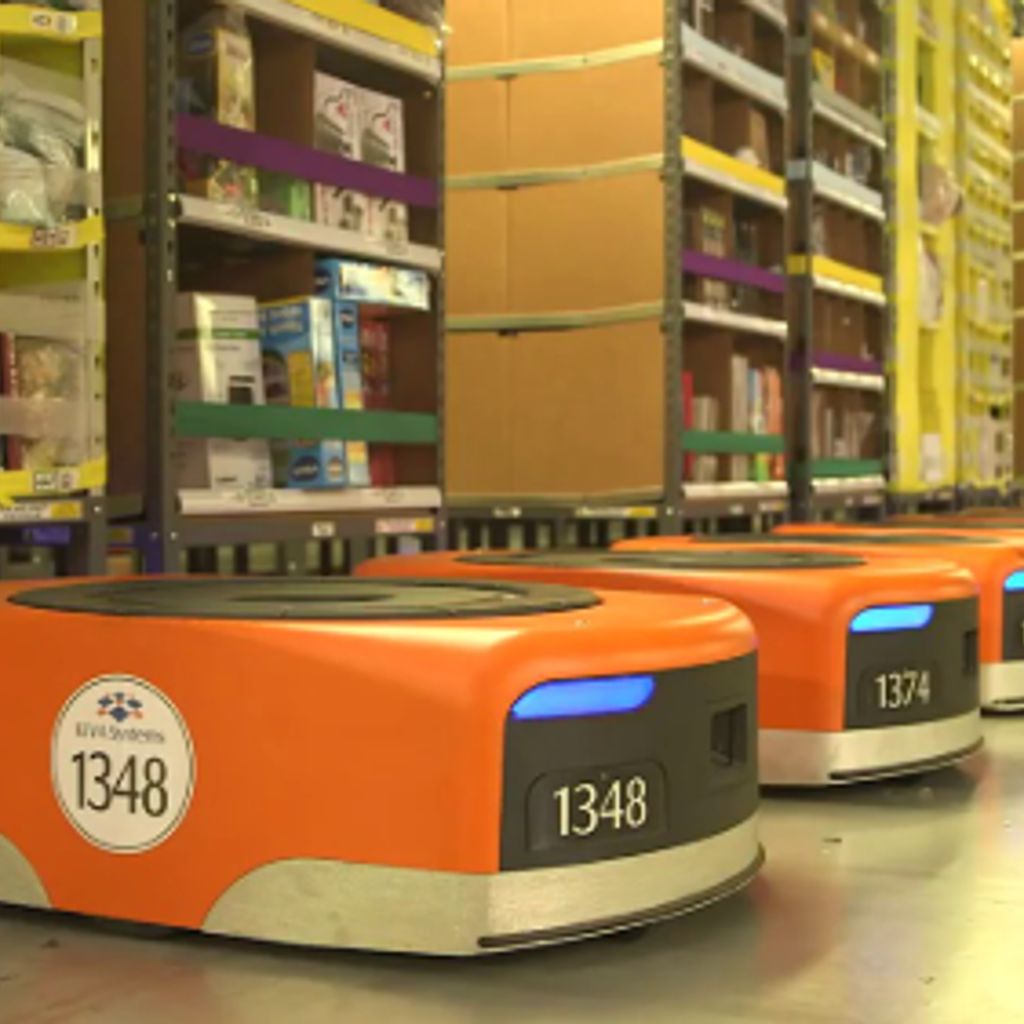 Physical AI robot working on a manufacturing floor alongside a human operator, representing the rent a robot market in 2026