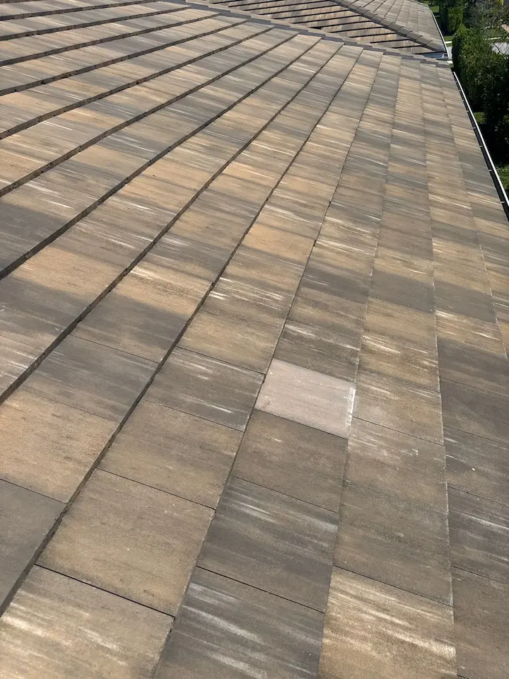 Flat tile roof in Bonita Springs after replacing broken field tiles to get ahead of a leak
