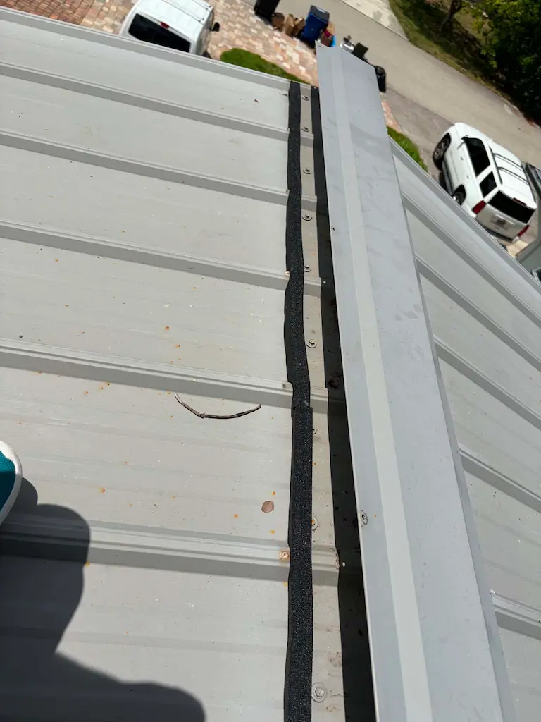 New outside foam closures at the ridge of an exposed-fastener metal roof in Bonita Springs