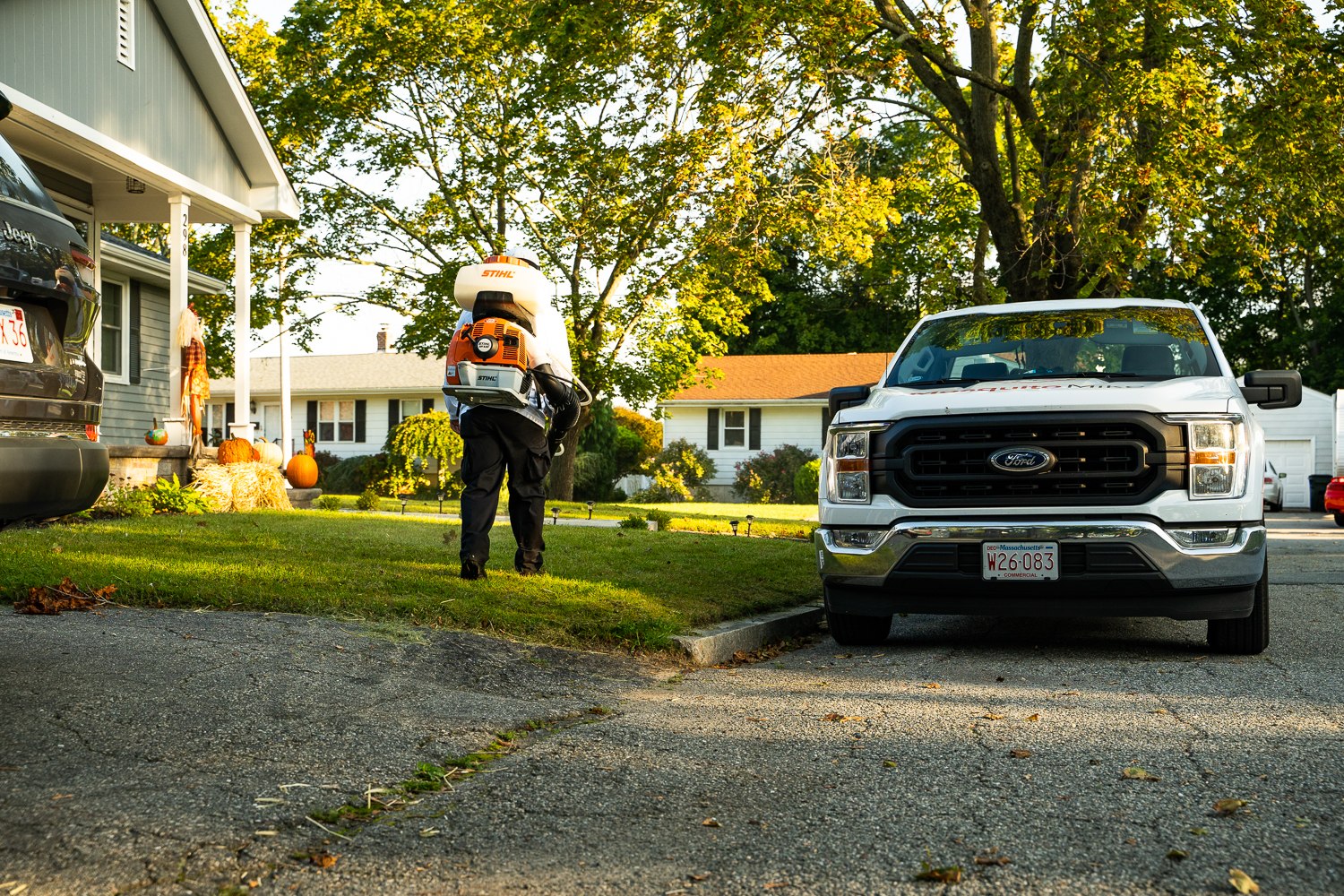 Mosquito Mike truck and technician on a fall treatment visit