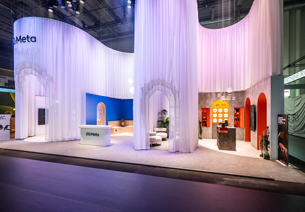 Detail of the multi-layer draped curtains of the Meta booth