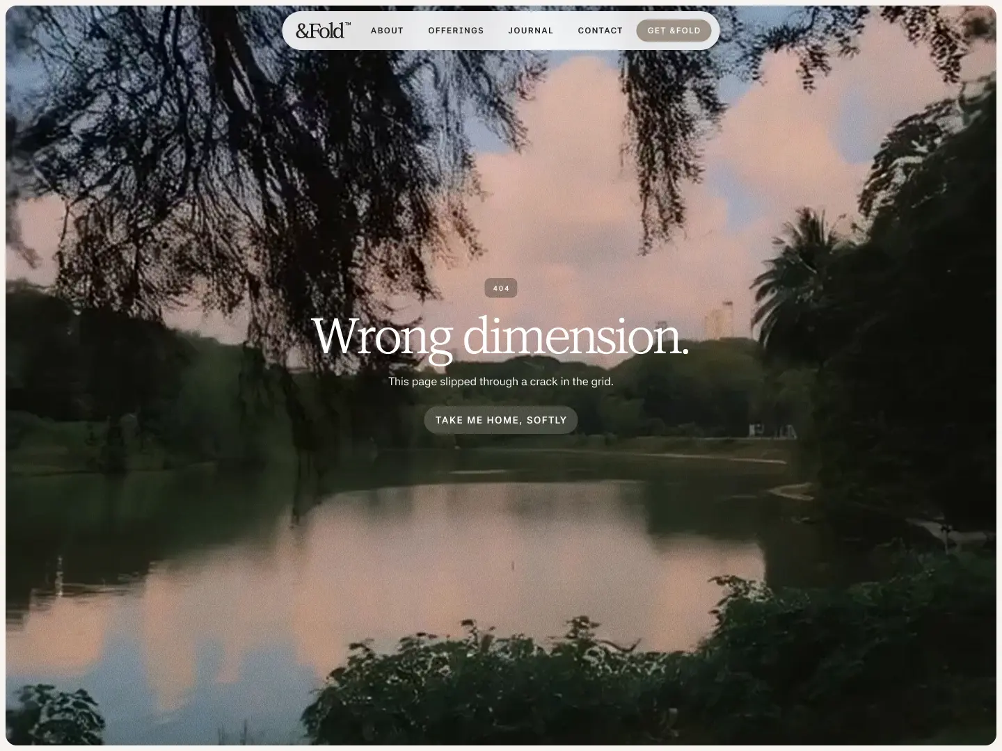 Calm lake surrounded by trees with a cloudy sky at sunset and an error message reading 'Wrong dimension.'