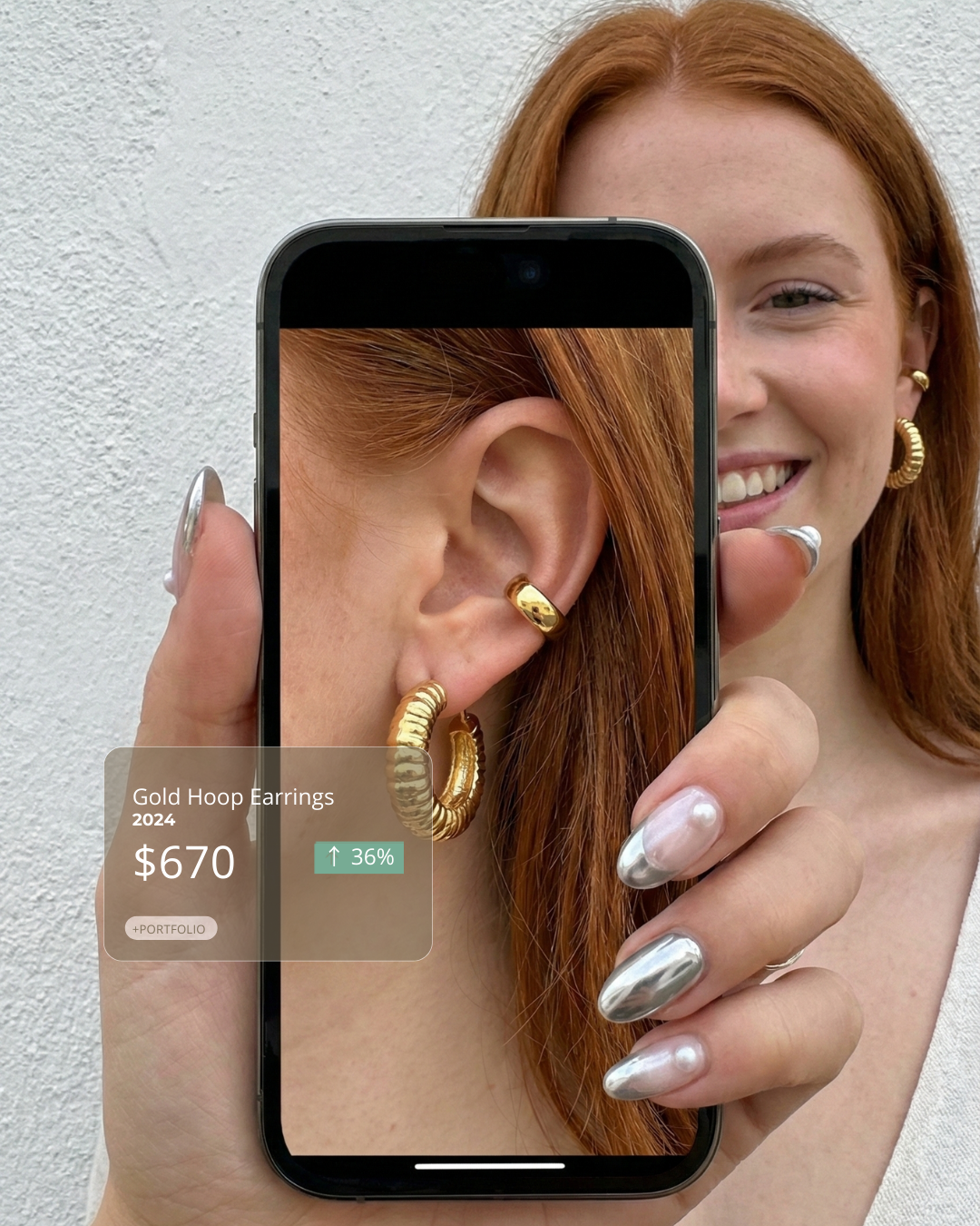 Woman wearing a gold chain necklace and holding another chain near her neck.