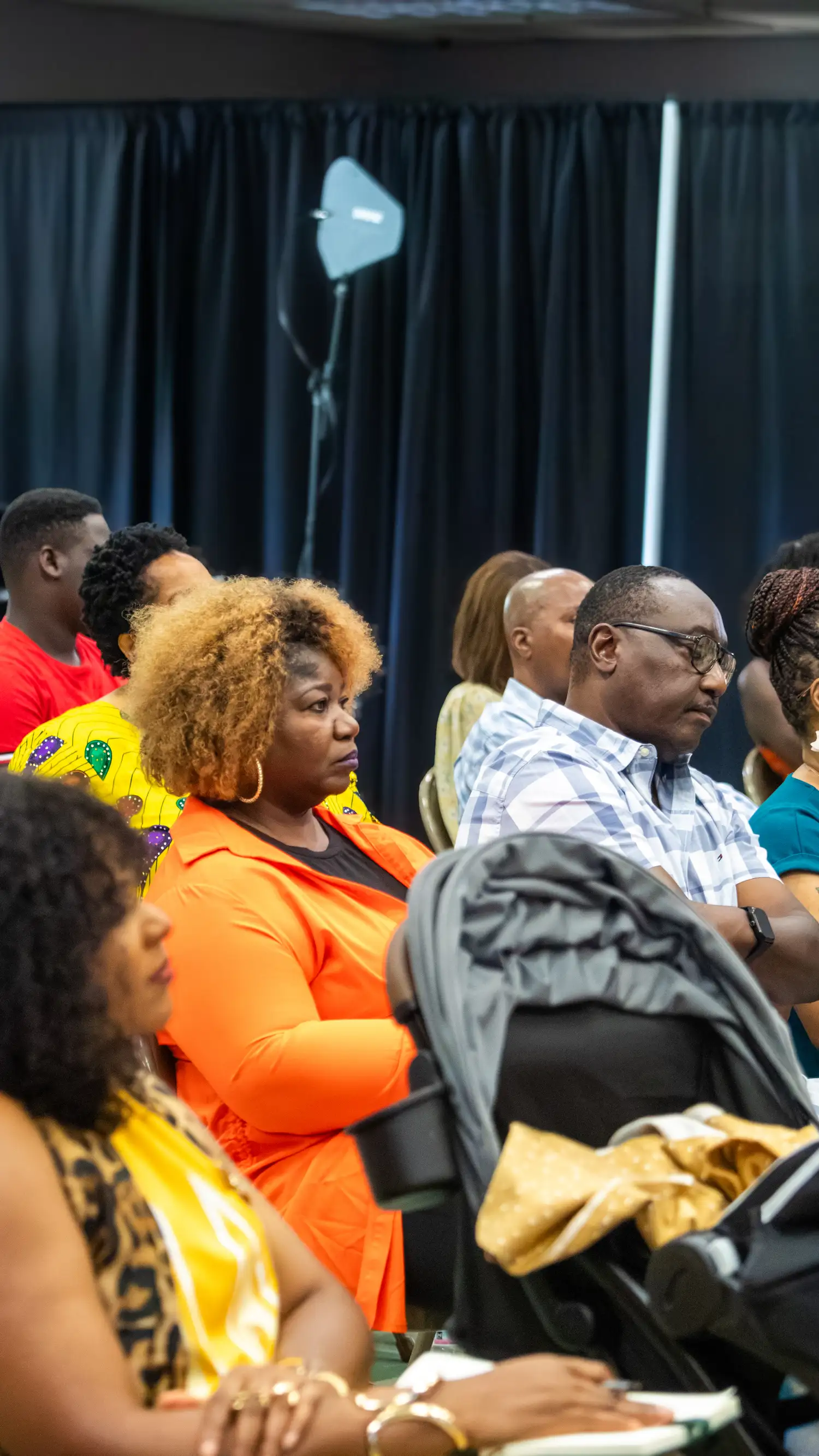 Members of the congregation seated and listening during a Sunday service at Restoration Church in Laurel, Maryland