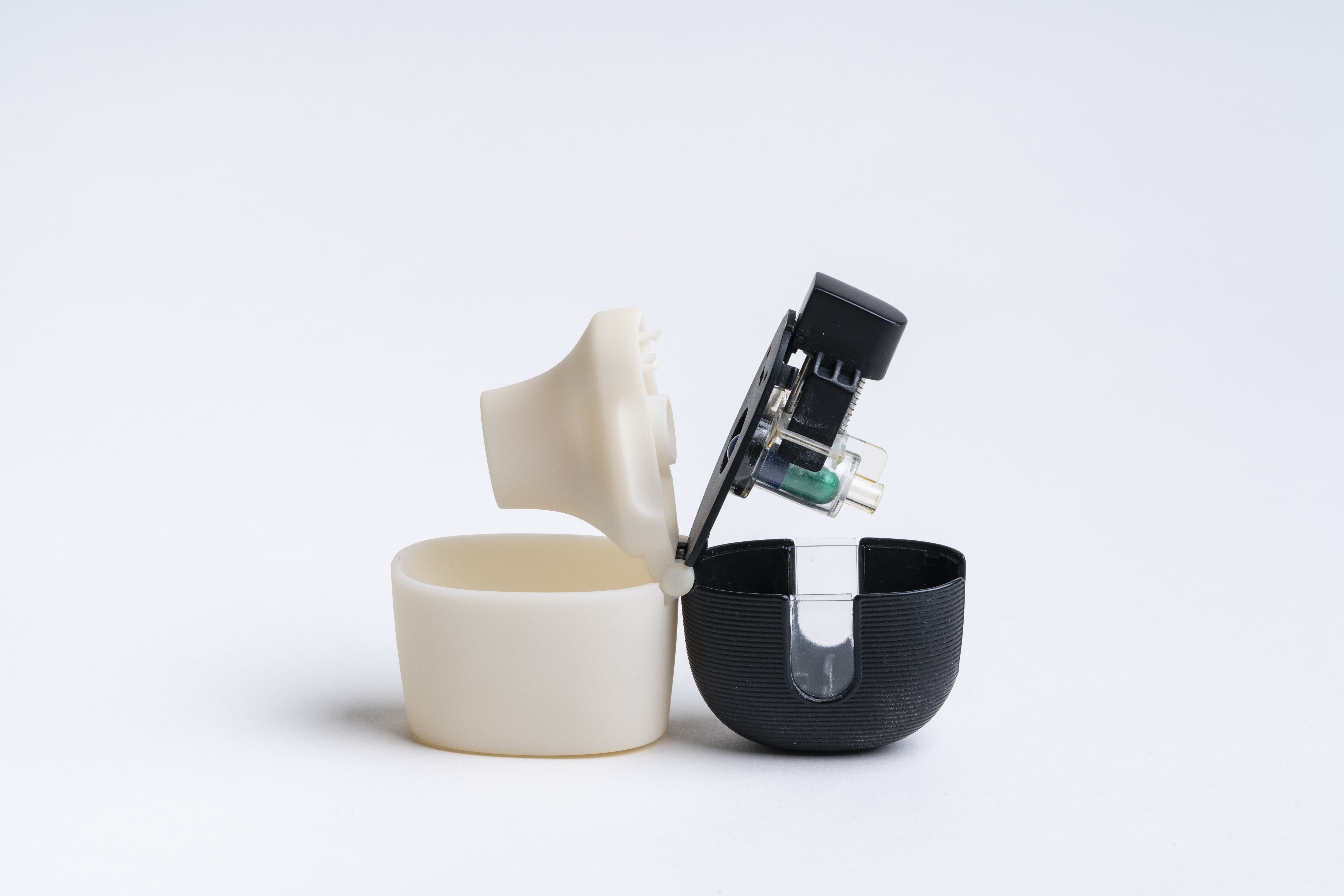 Medical device prototype housing opened to show the electronics inside