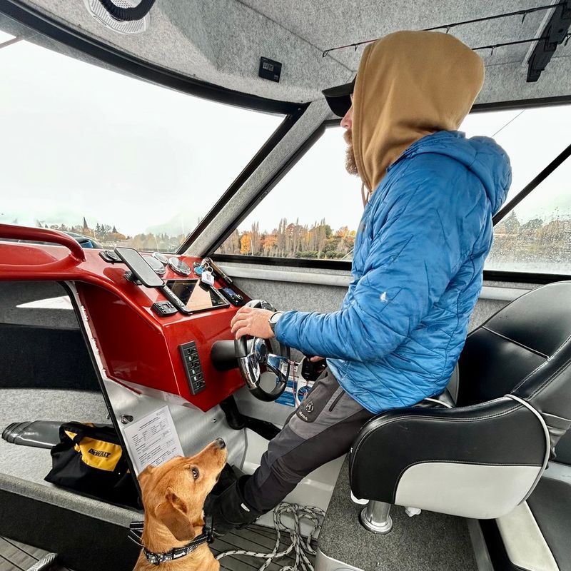 Nala the dog in the cabin with the skipper on a Reel South Charters trip