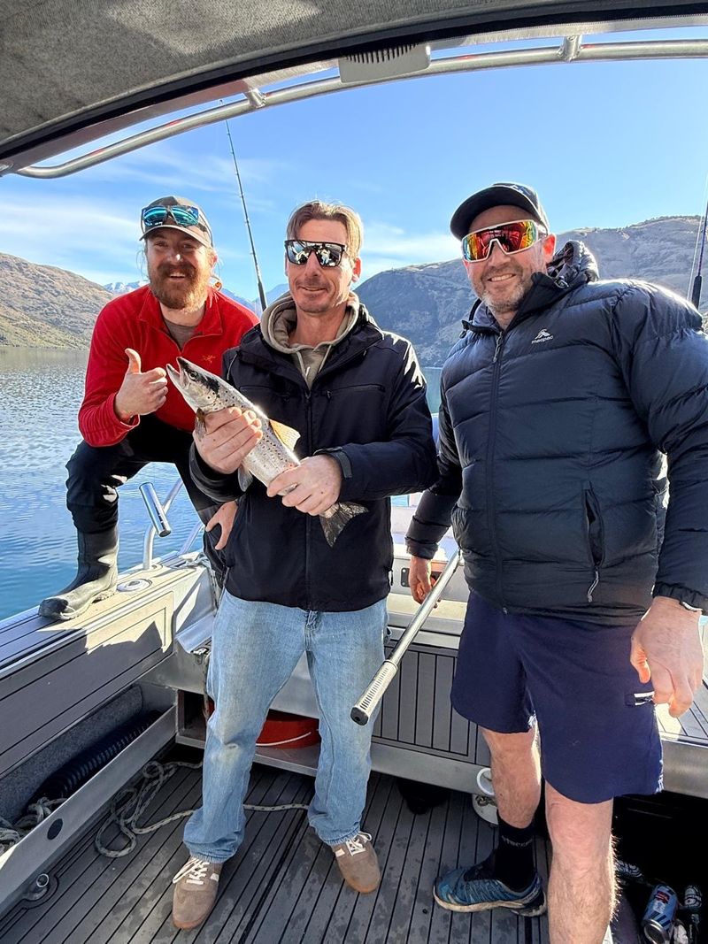 Guests celebrating their catch on Lake Wānaka