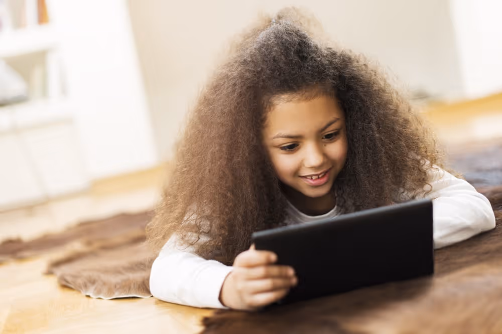 Student engaging in a learning activity using a tablet.