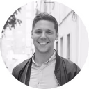 a man smiling at the camera