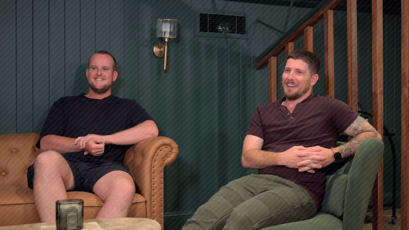 two men sitting in chairs