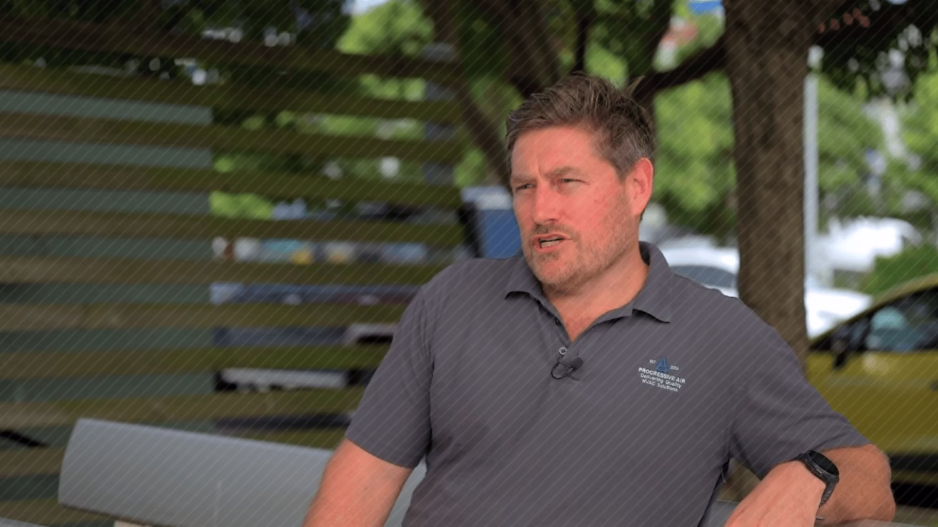 a man in a grey shirt