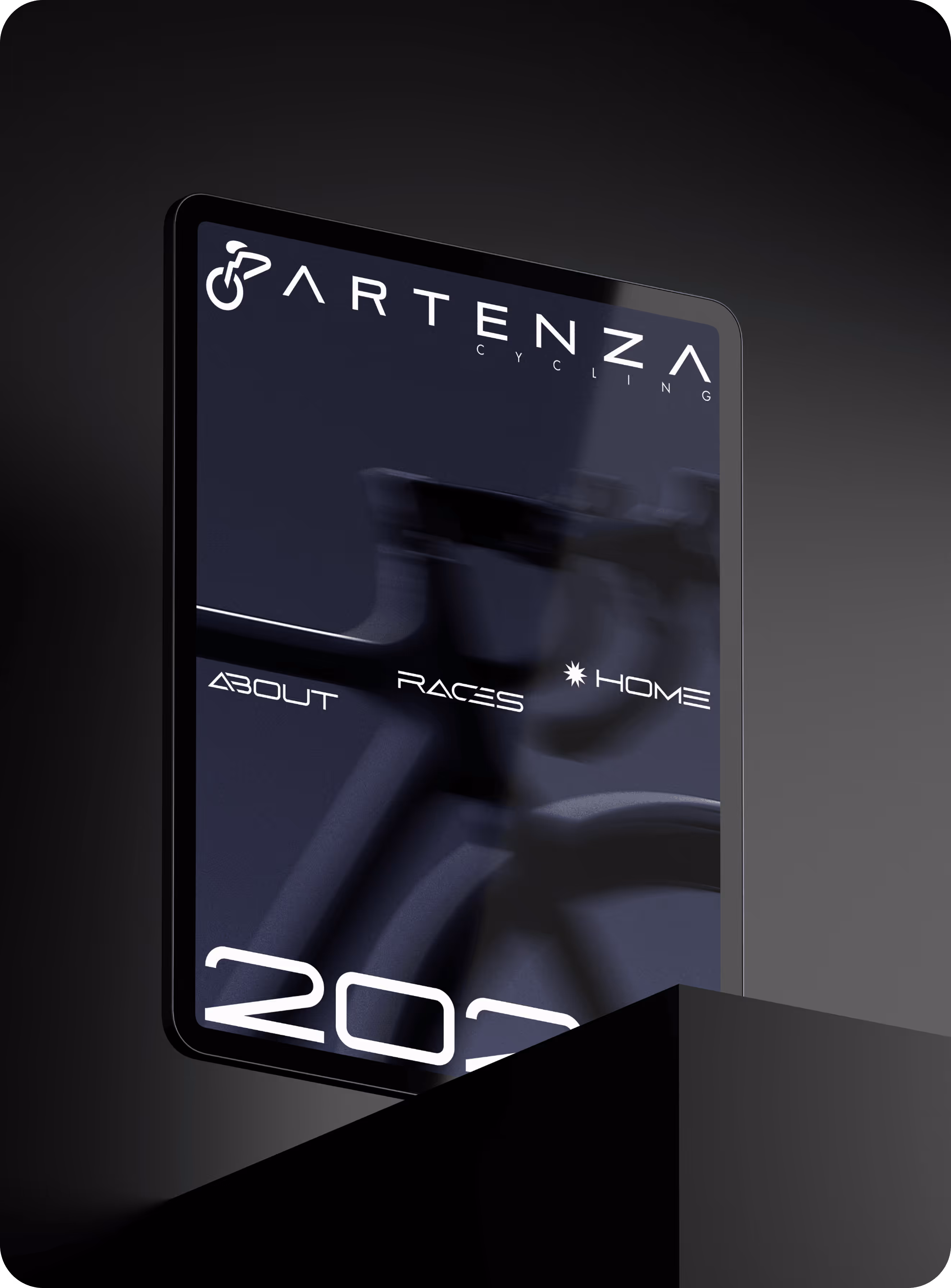 Tablet display showing Artenza Cycling website with blurry bicycle image and menu options.