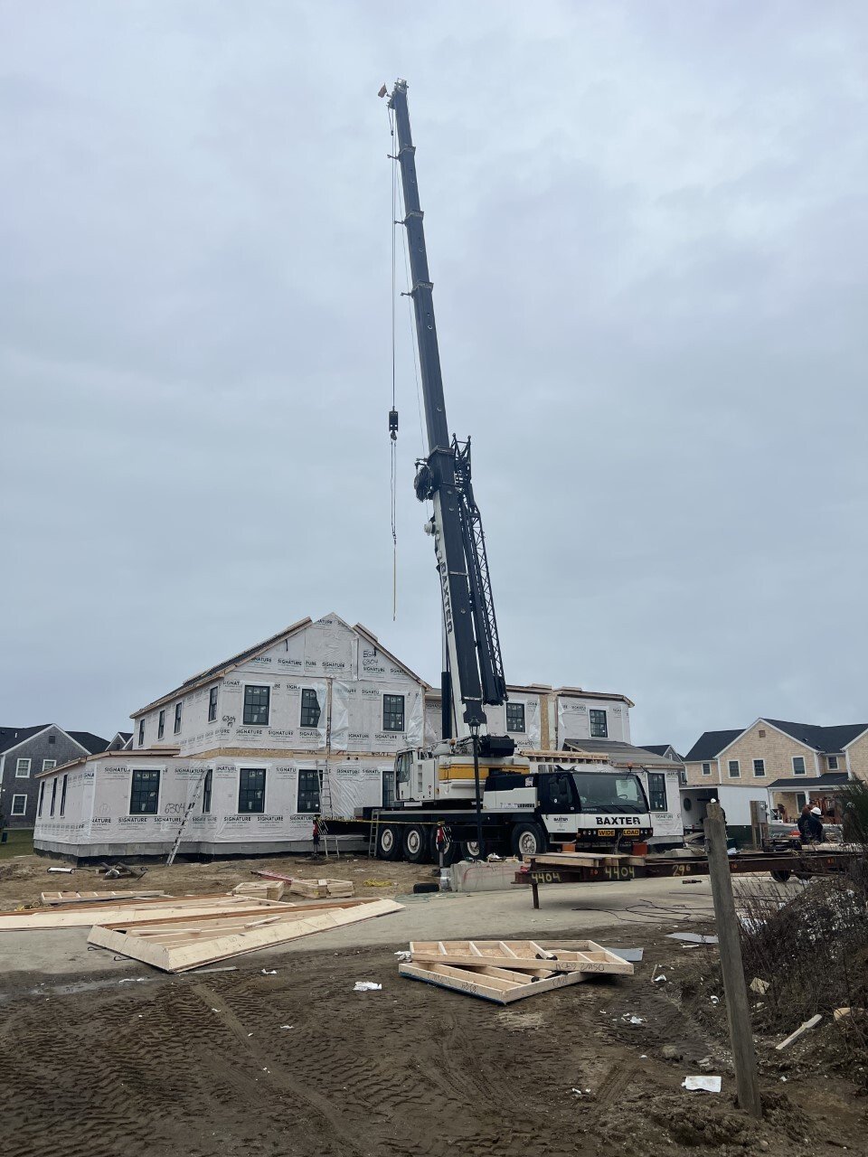 Baxter Crane delivering framing materials at residential development