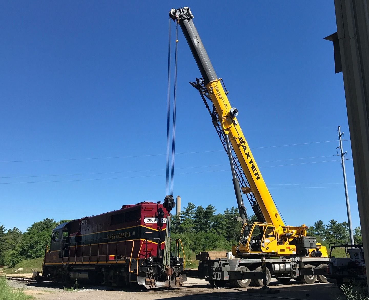 Baxter Crane lifting equipment alongside Mass Coastal locomotive
