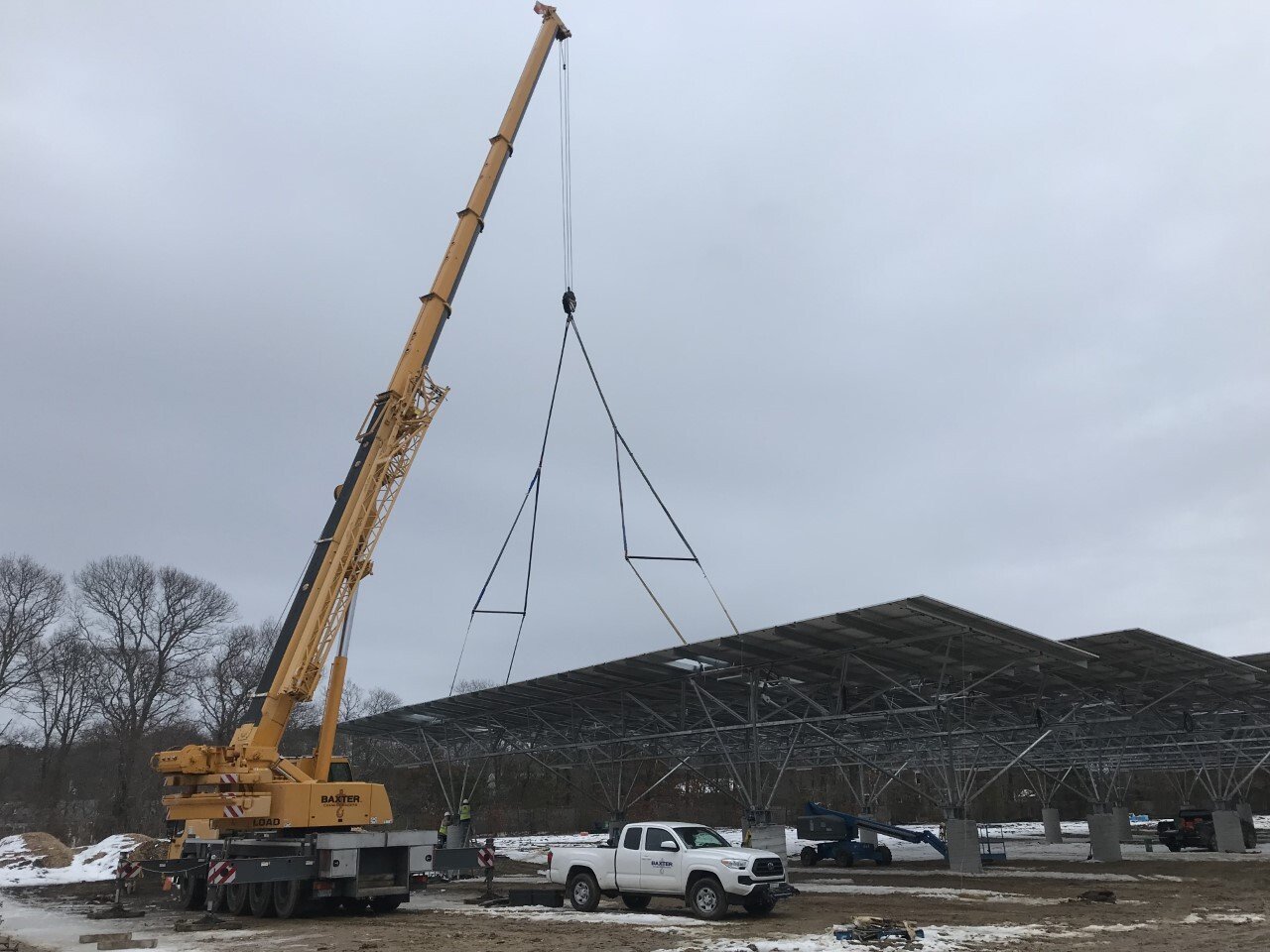 Baxter Crane installing solar panel array
