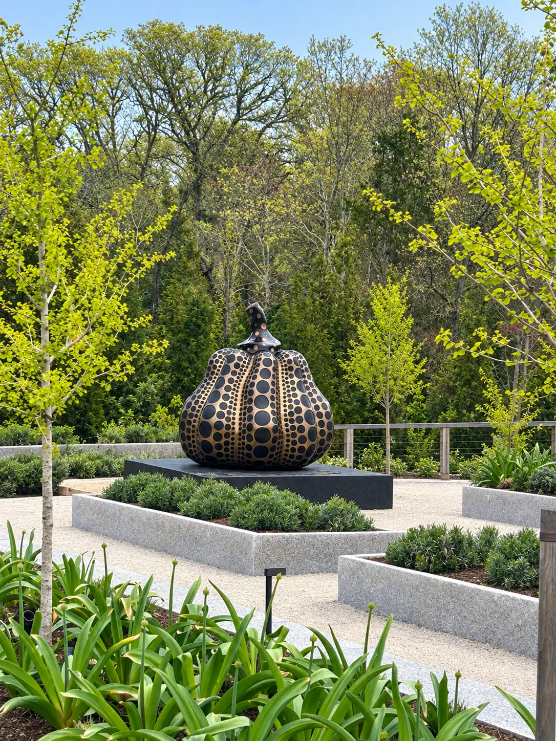 Yayoi Kusama pumpkin sculpture installed in a garden after a Baxter Crane rigging lift
