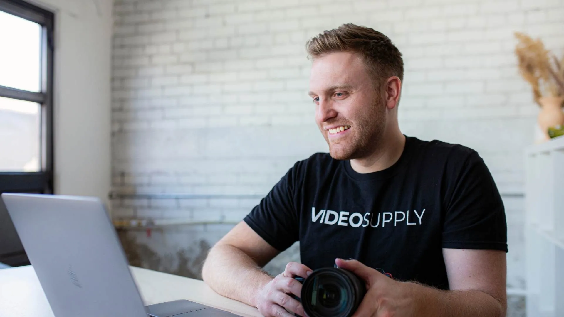 video supply team at computer with camera dallin nead