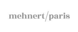 Logo mit dem Text 'mehnert/paris' in grauer Schrift.