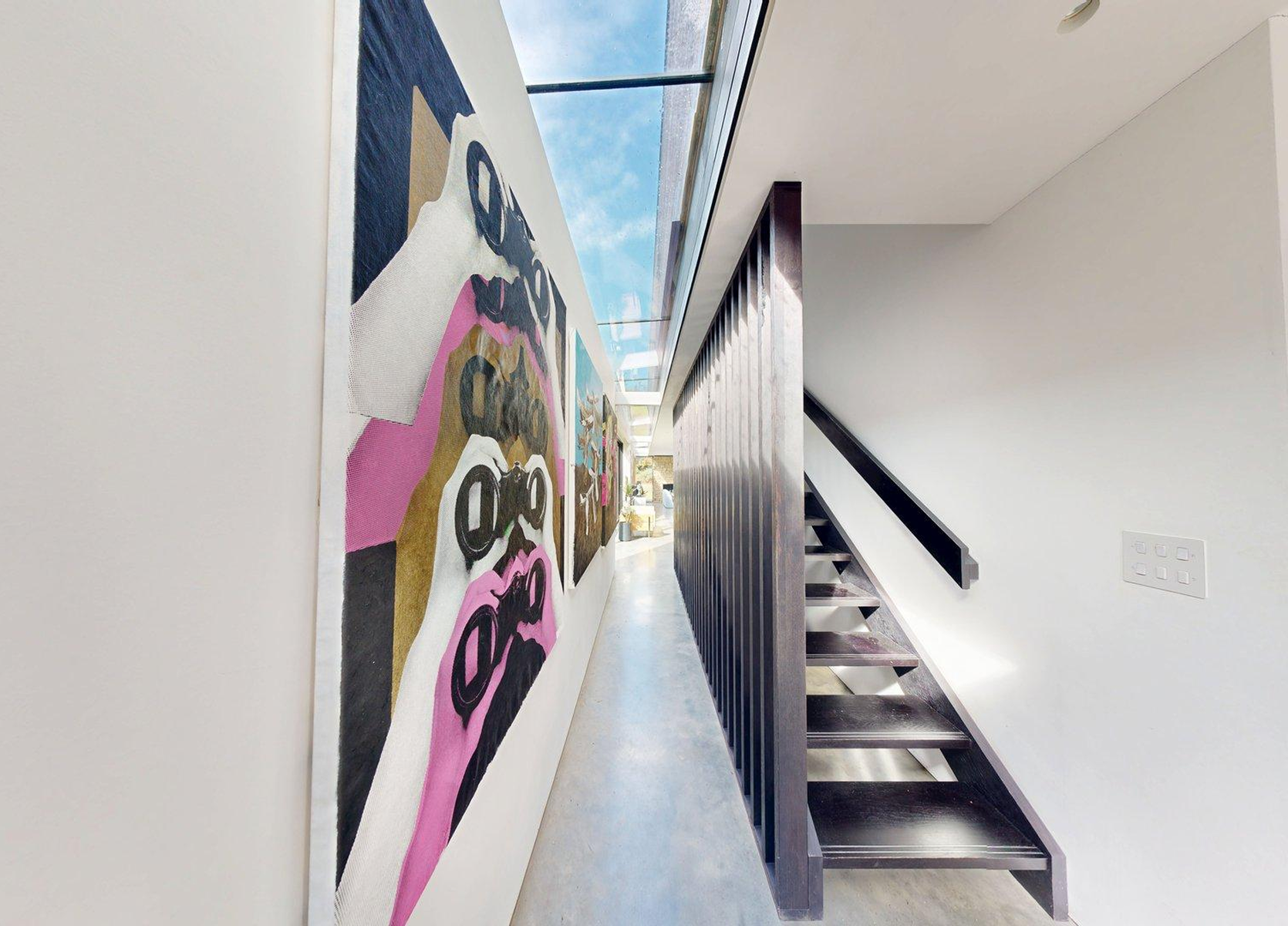 View from the deck of a boat looking out towards a pier and the open water.