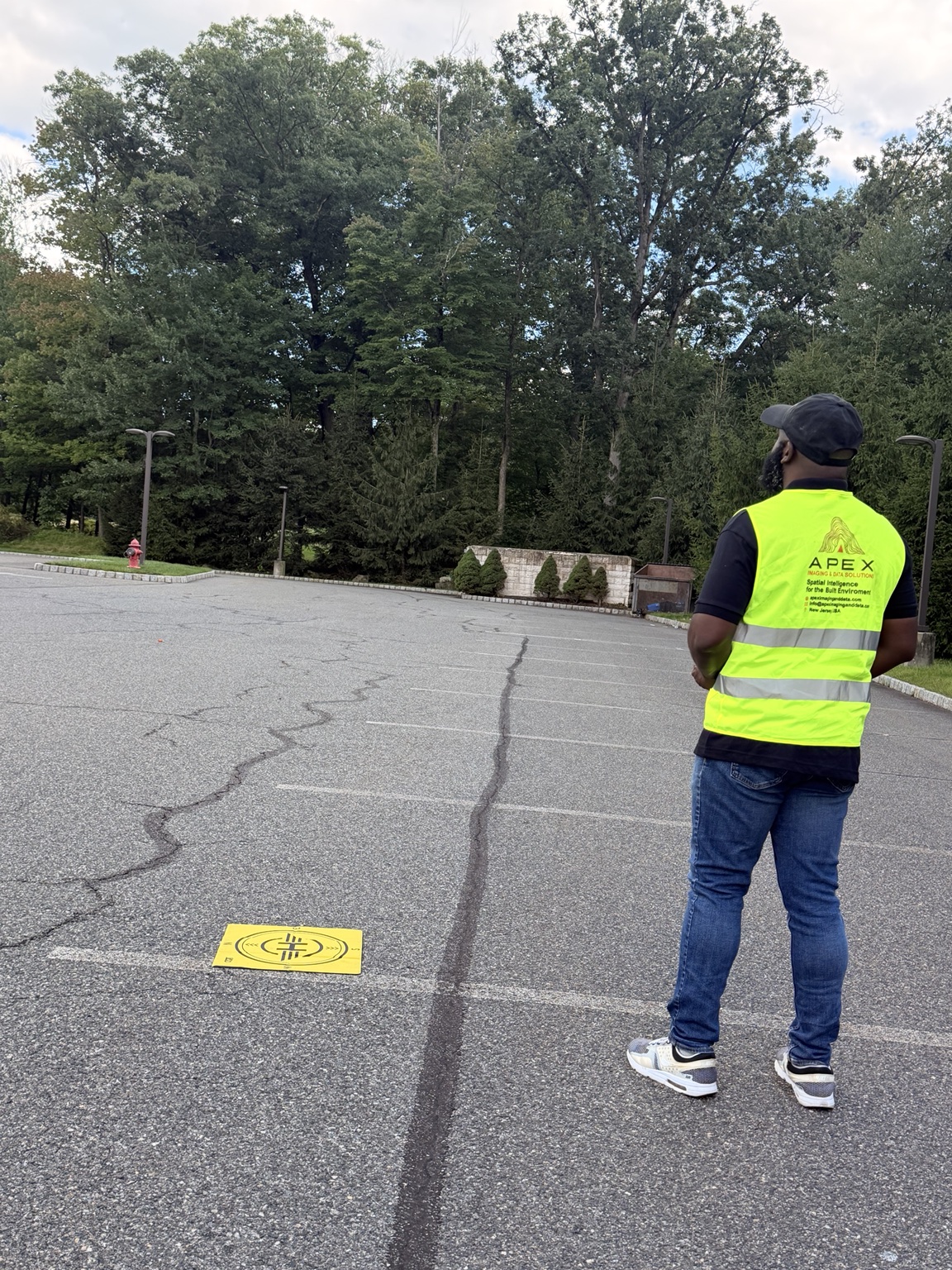 Jay Tucker conducting field operations in a high-visibility Apex safety vest