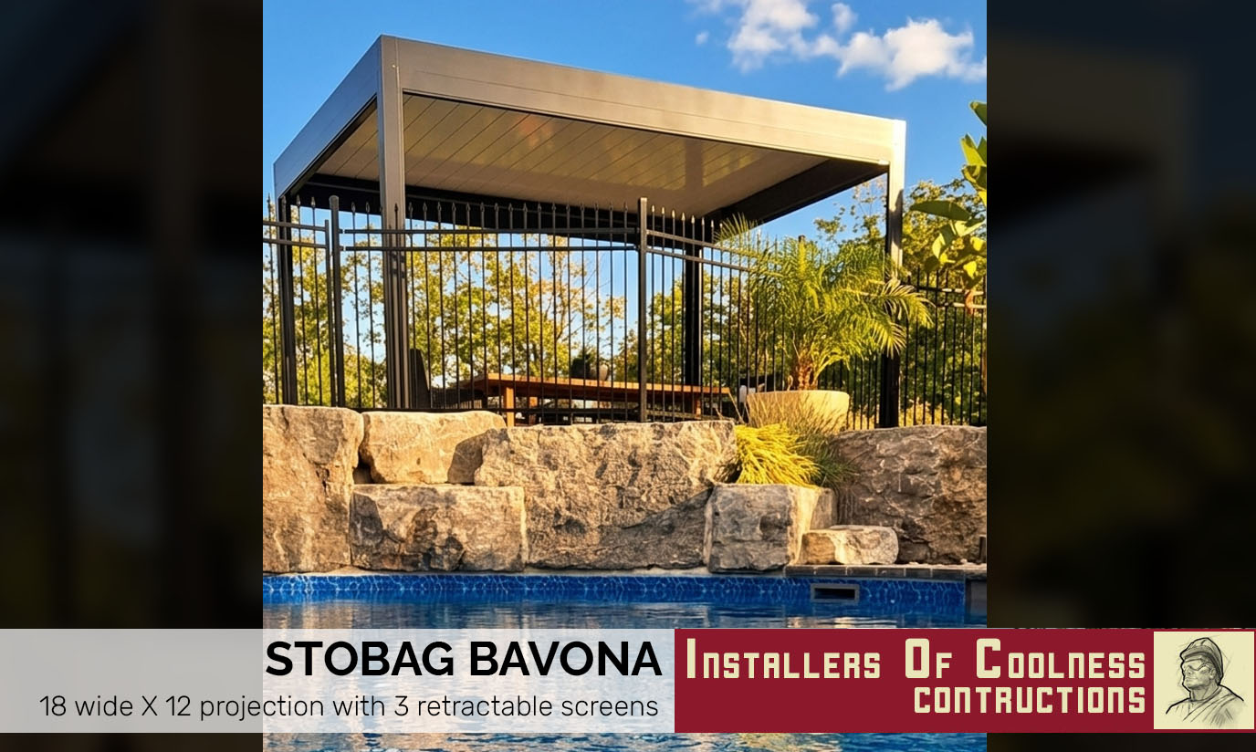 Black metal awning above a door on a brick building wall.