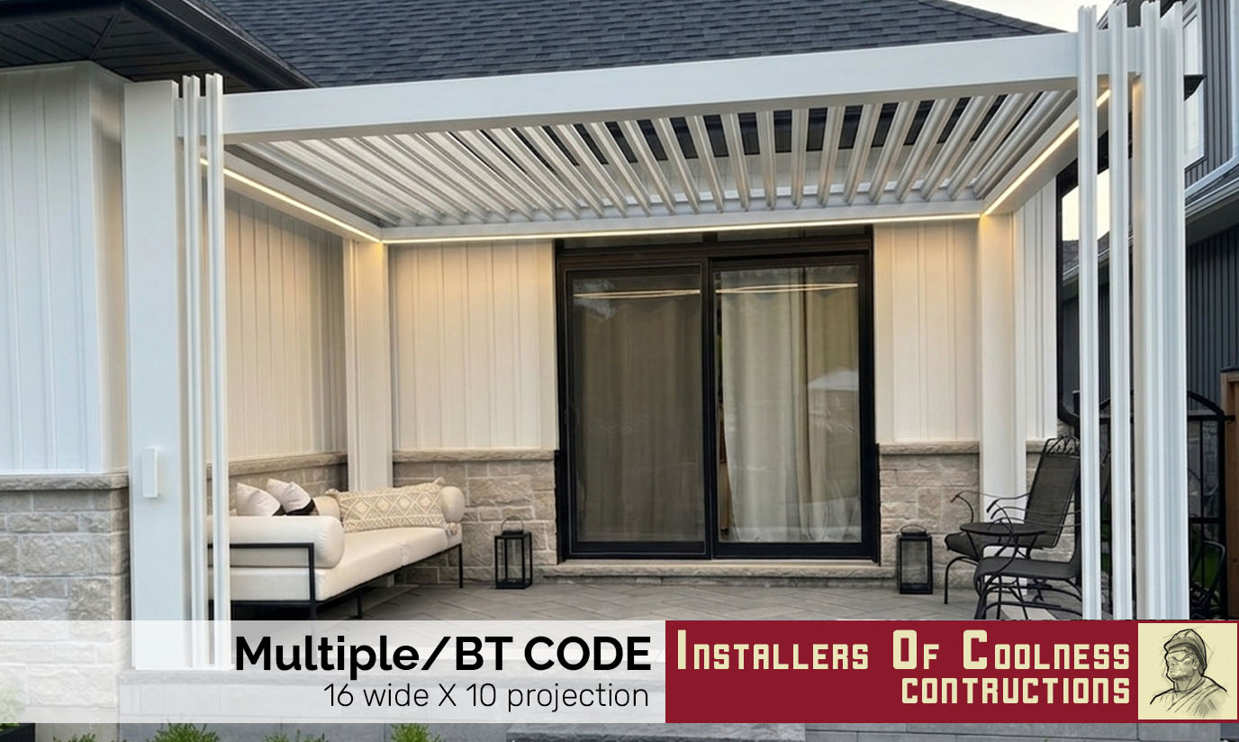 Black metal awning above a door on a brick building wall.