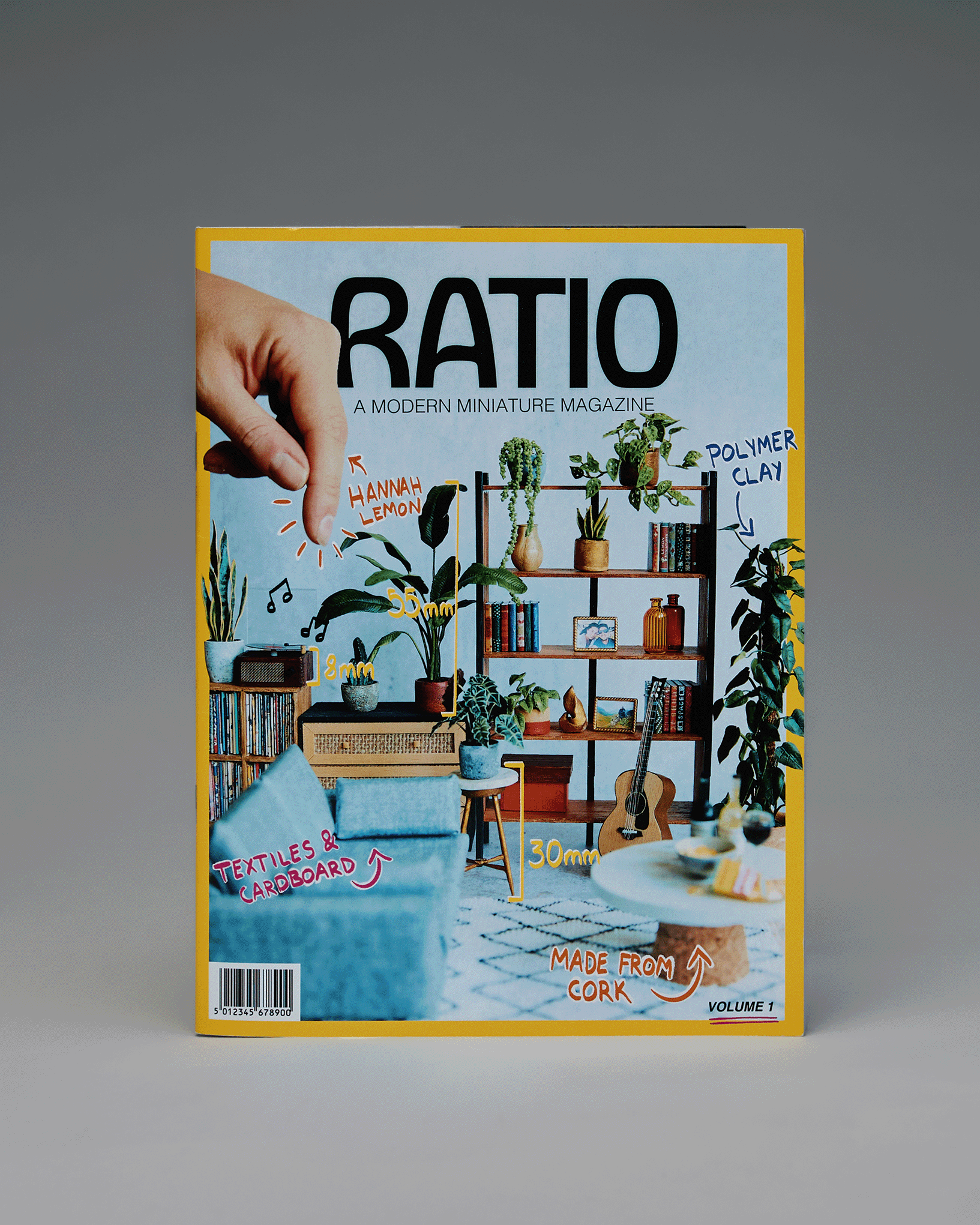Cover of Ratio magazine showing a miniature living room with measurements and materials labeled.