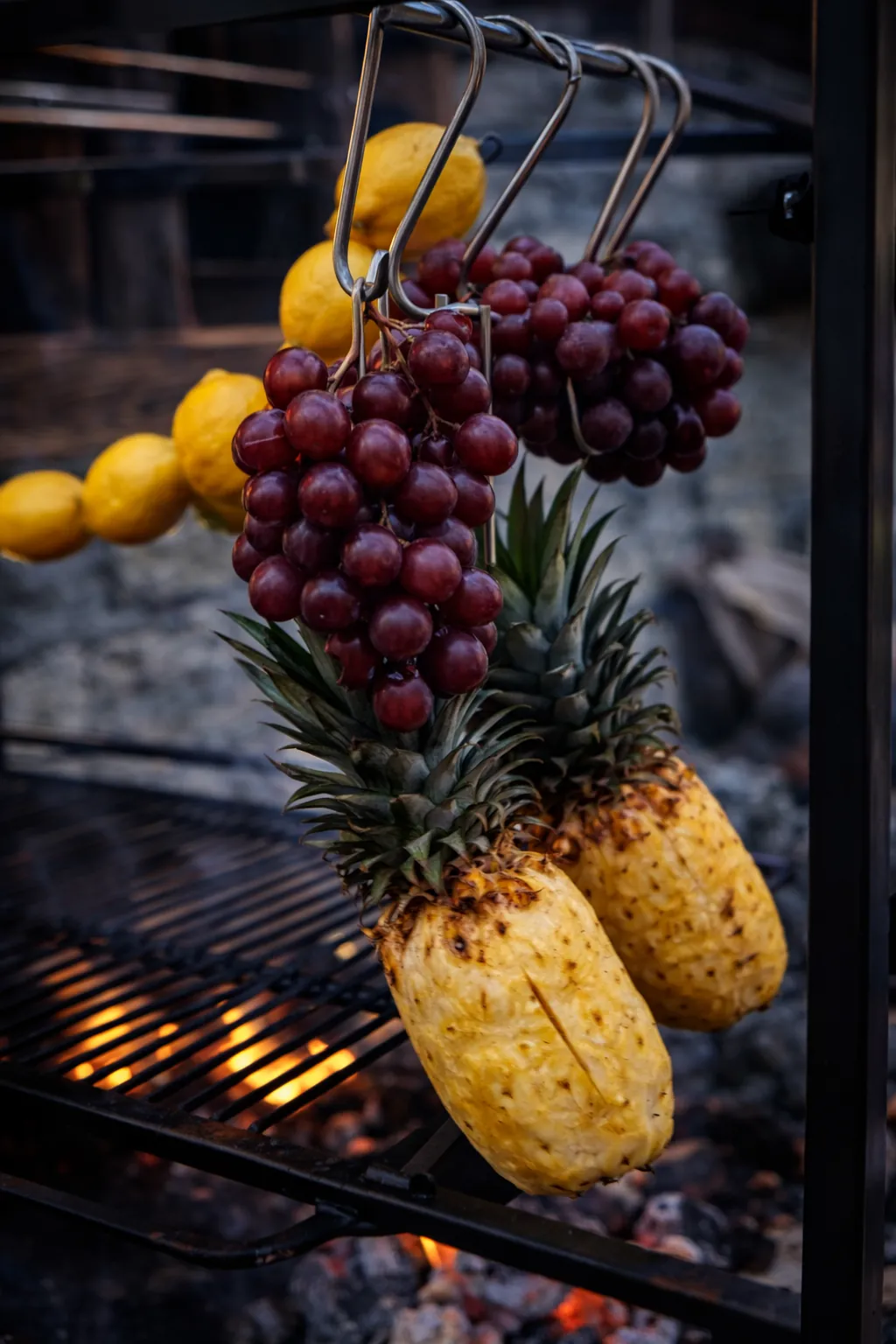 Grilled pineapple and grapes over open fire