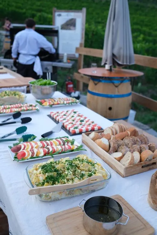 Salad and bread table beside the vineyard