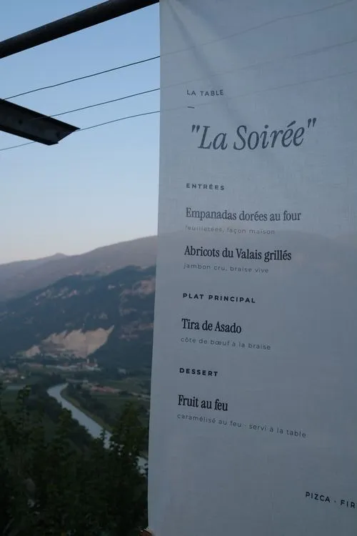 La Soiree menu banner over the valley