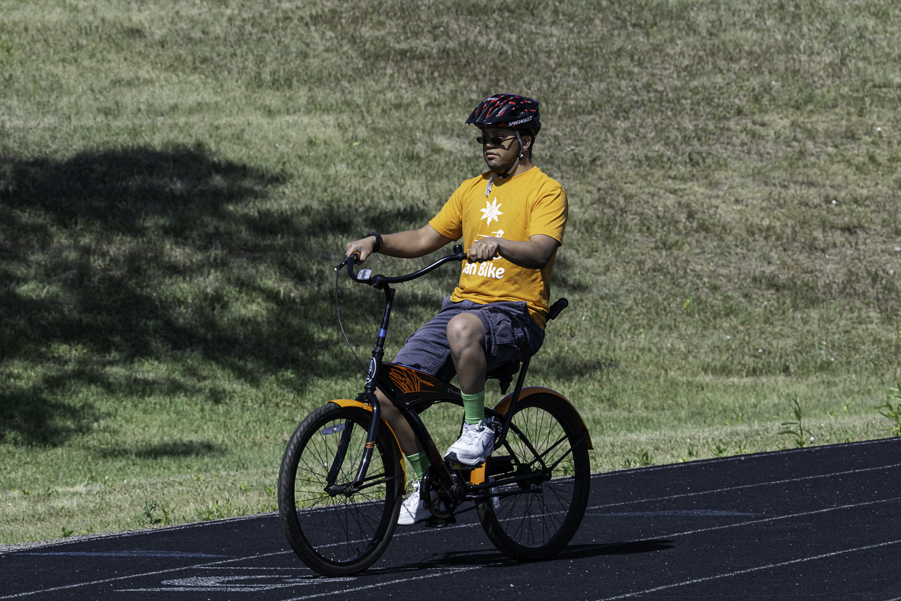 Kids with disabilities riding bikes independently during Cycle Movement's adaptive cycling program in Colorado, smiling and building confidence