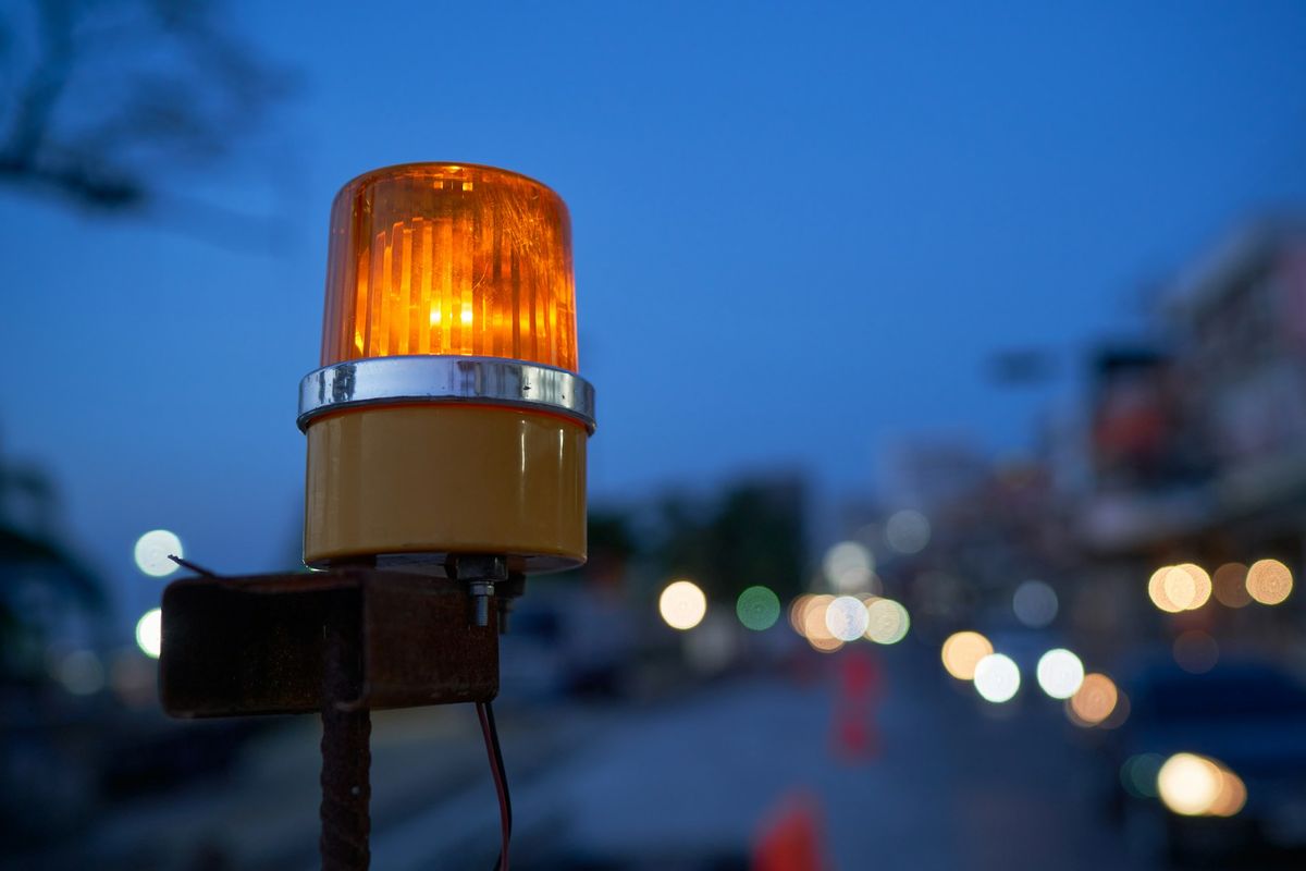 a traffic light sitting on the side of a road