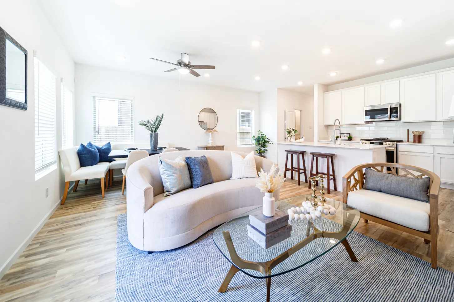 Dining area with table and chairs and living area with sofa