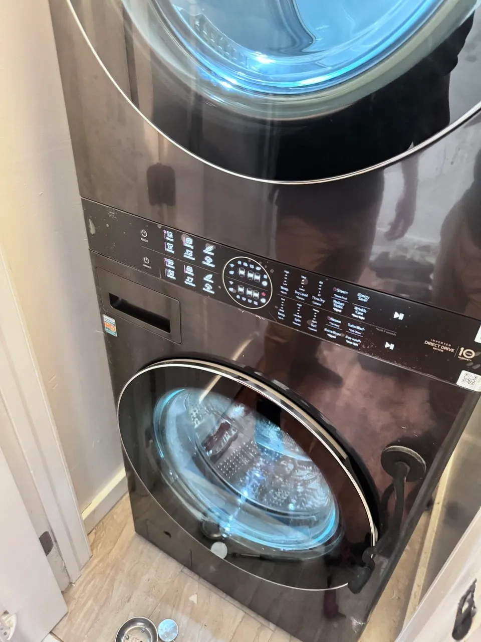 LG stacked washer and dryer unit in laundry room
